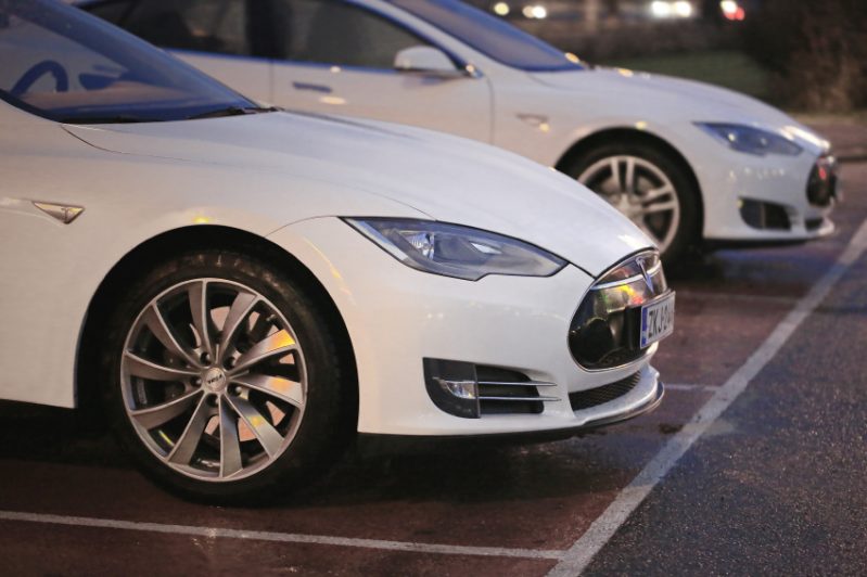 Two White Tesla Model S Cars at Night