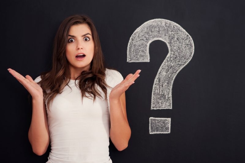 Woman confused over what to do with a big question mark
