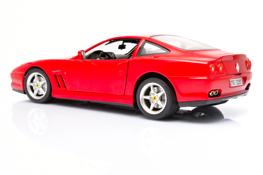 Kampen, The Netherlands - July 20, 2012: Red Ferrari 550 Maranello modell car isolated on a white background in a studio.