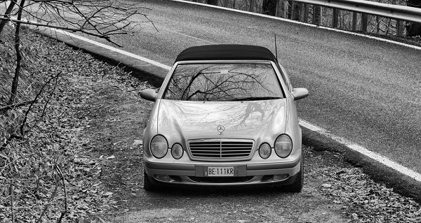 Borgio Verezzi, Italy - December 28, 2006: Mercedes Benz Car parker near a country road. Photo taken in a public area