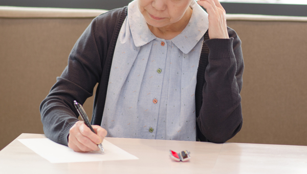 woman is writing a document